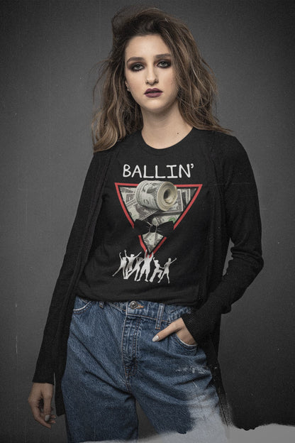 Close-up of Ballin’ graphic on a black tee with framed cash-roll collage