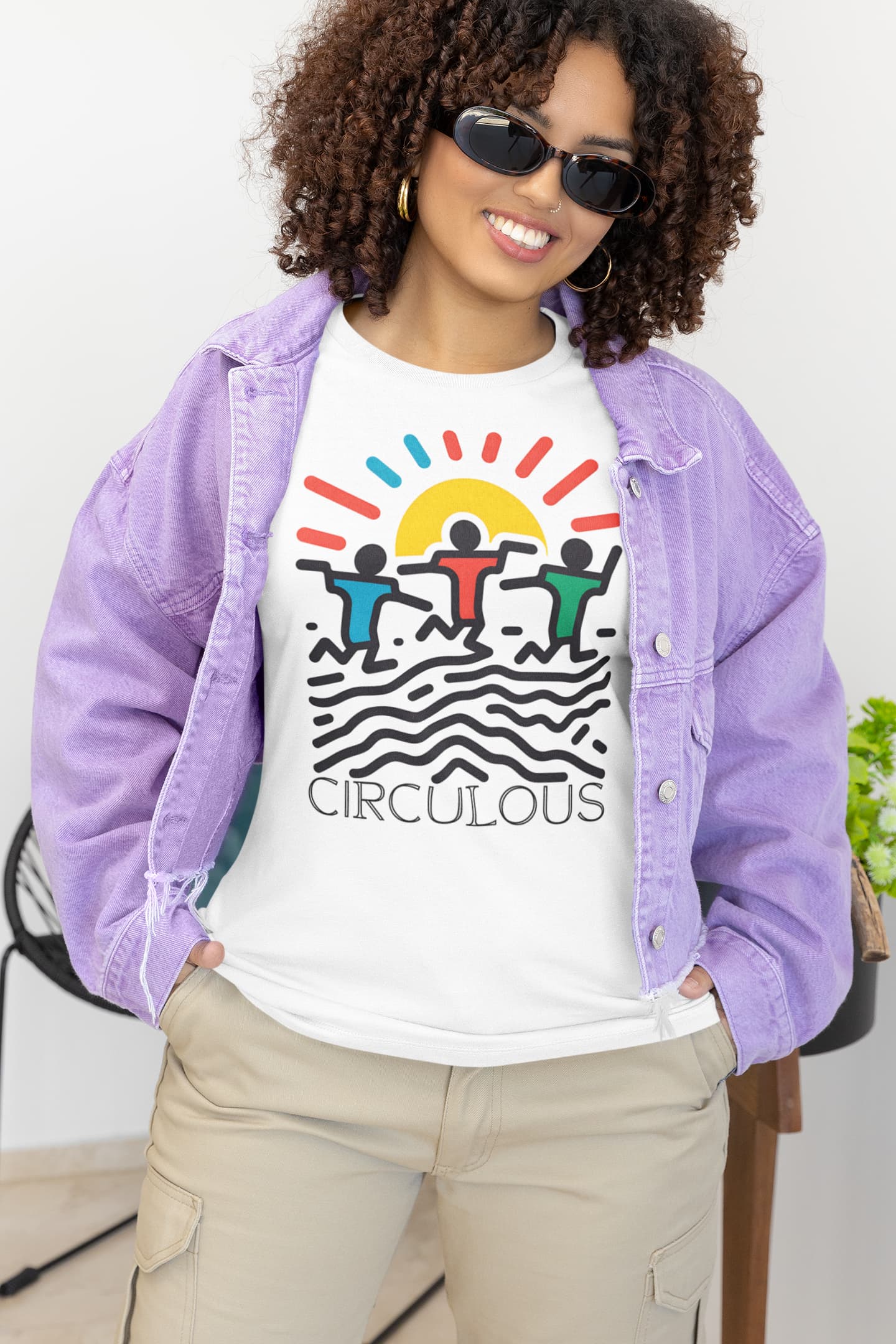 Pop art graphic tee Sunburst Moves sun wavy lines primary colors

